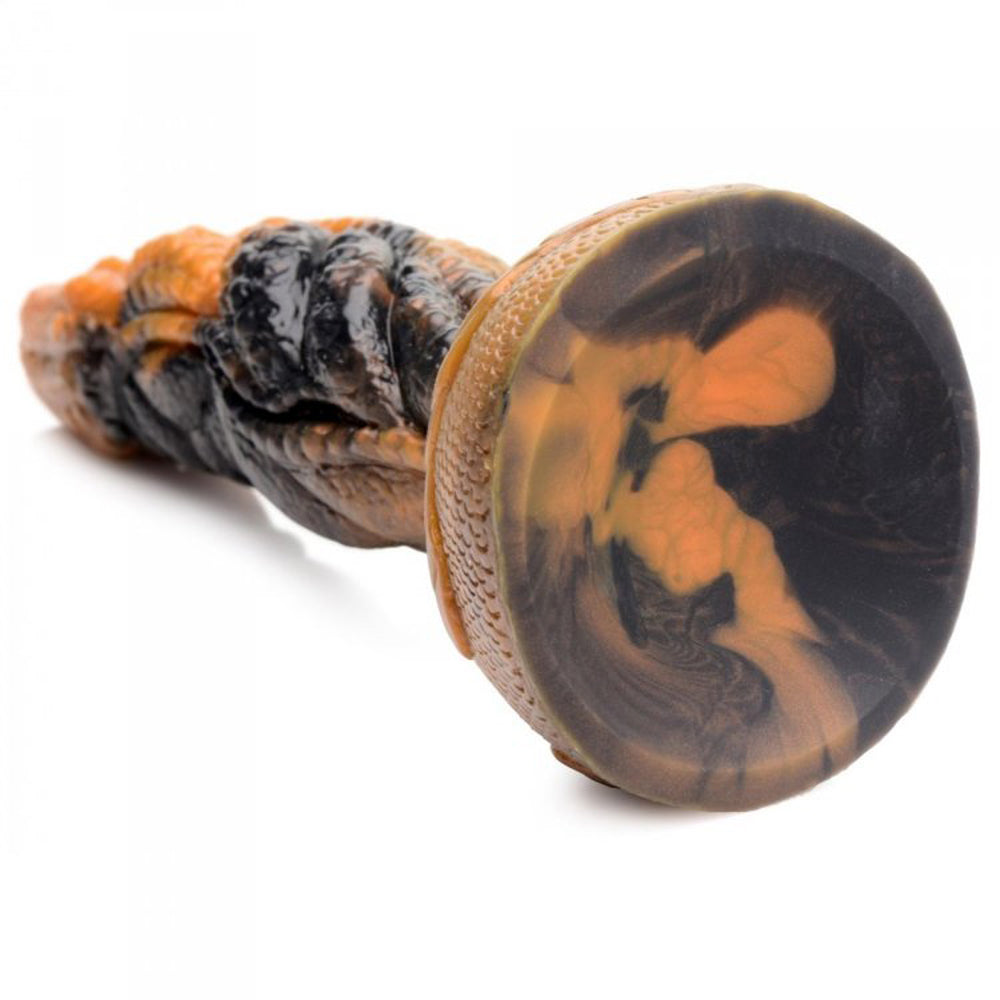 A marbled orange and black silicone dildo with a textured tentacle shaft and suction cup base.