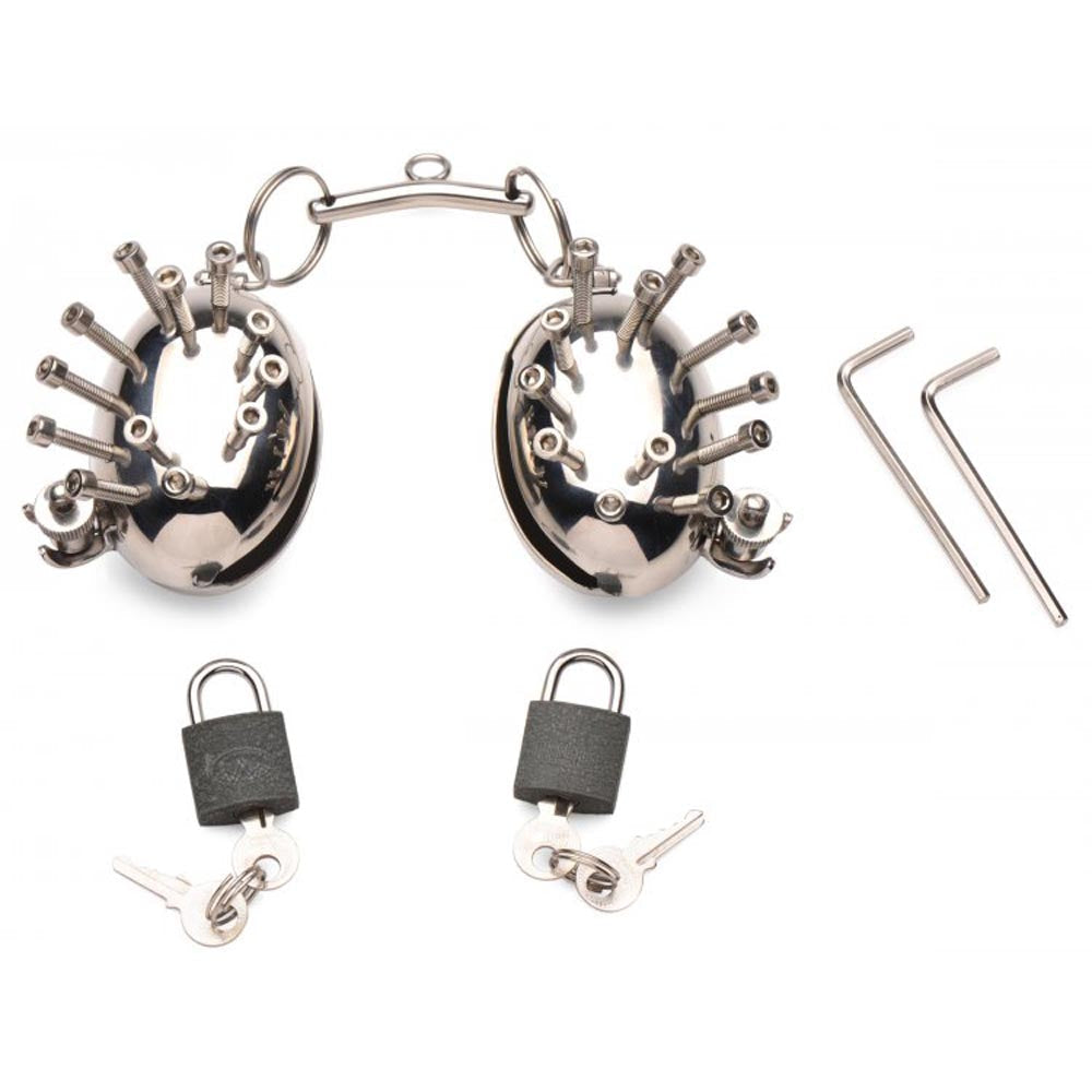 Stainless steel spiked testicle cages with locks and keys.