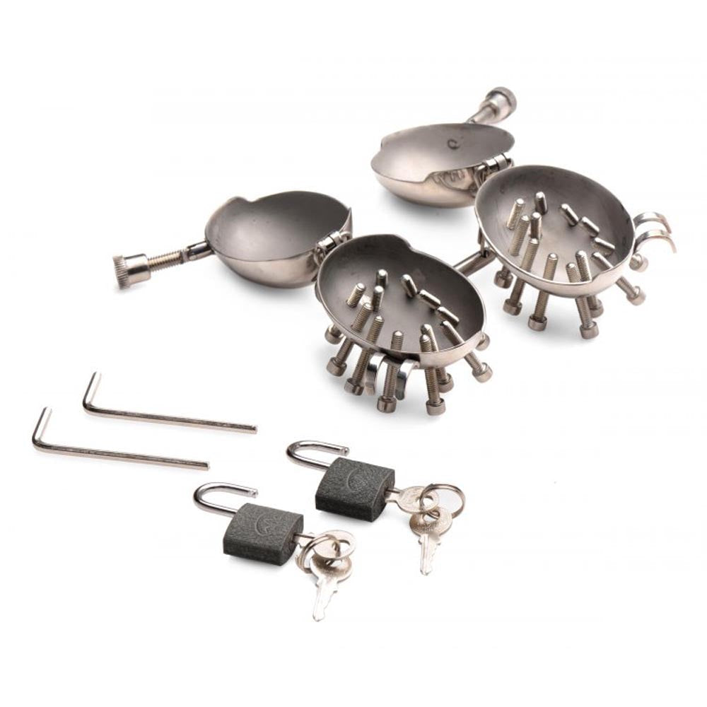 Stainless steel spiked testicle cages with locks and keys.