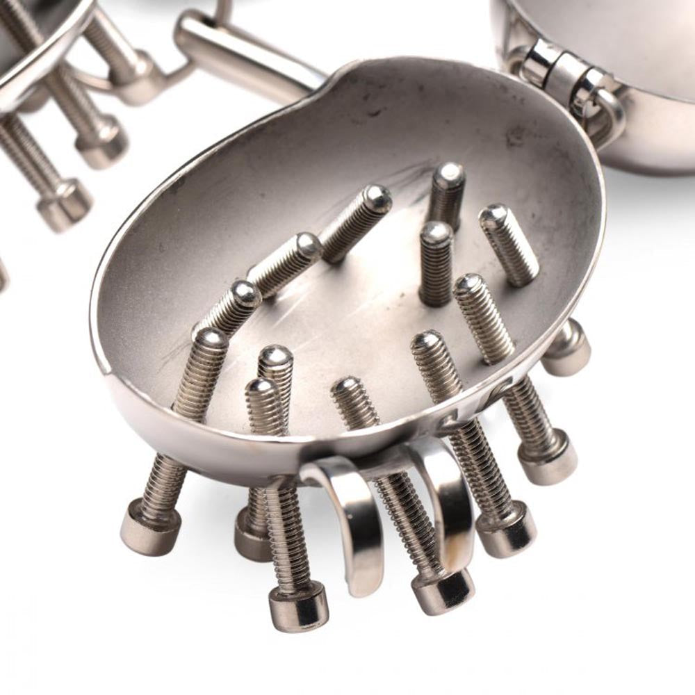 Stainless steel spiked testicle cages with adjustable screws and a lock.
