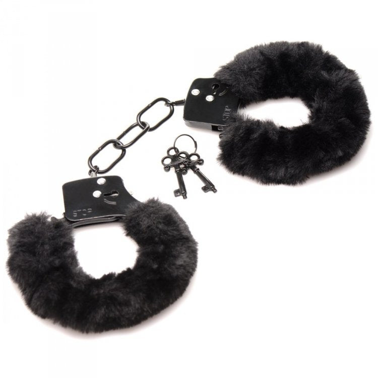 Black furry handcuffs with metal locks and two keys.