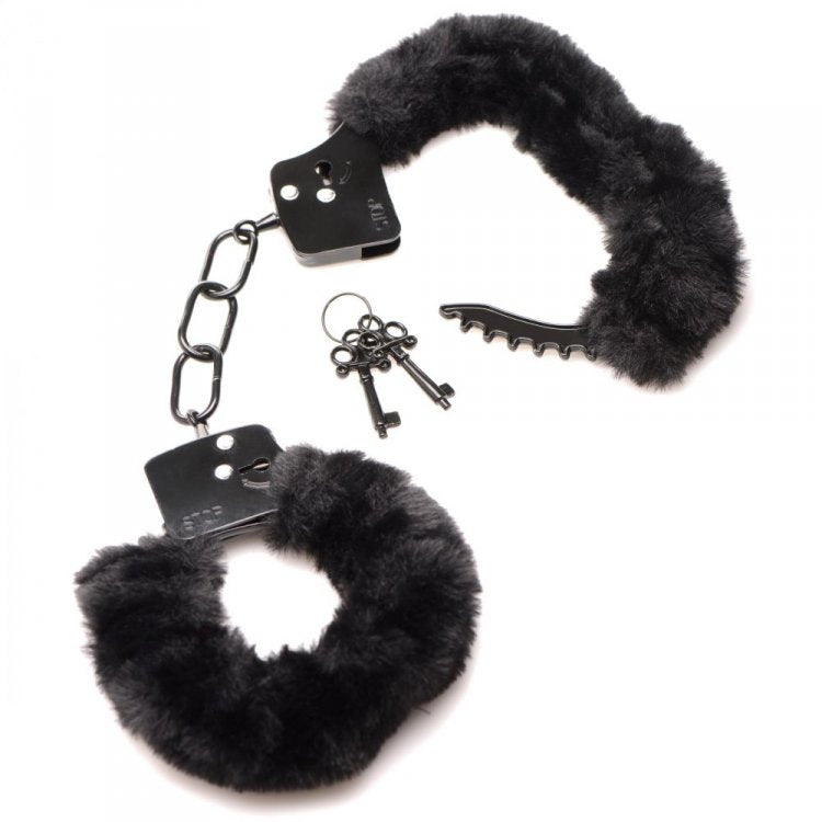 Black furry handcuffs with metal locks and two keys.