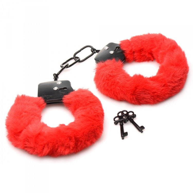Red faux fur handcuffs with black metal accents and two keys.
