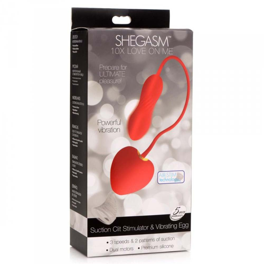Red suction clit stimulator and vibrating egg with "SHEGASM" branding.