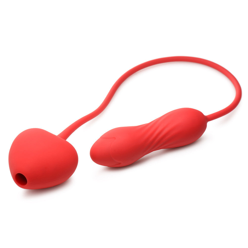 Red silicone clitoral suction stimulator with a vibrating egg.
