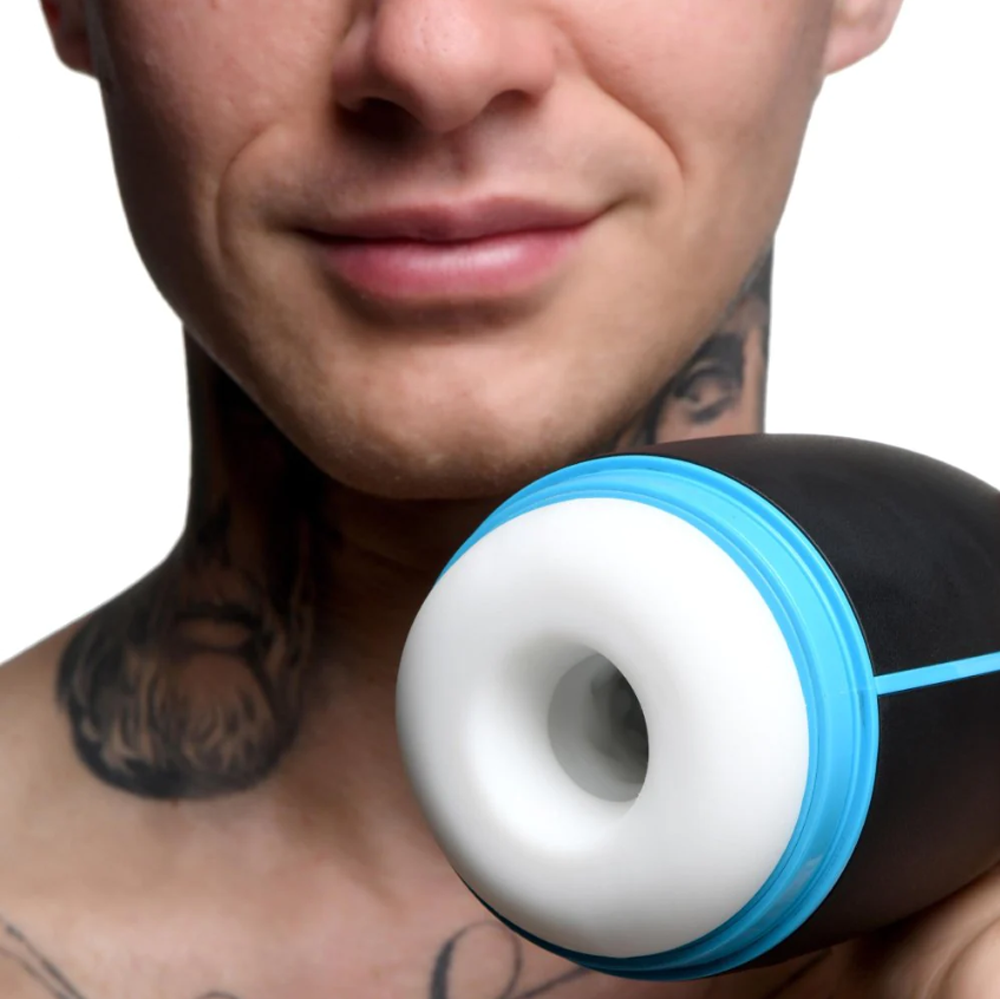 Black and blue vibrating masturbator with a white interior.