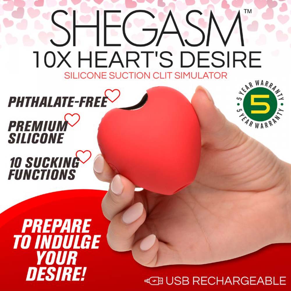 Red heart-shaped silicone clitoral suction toy with warranty information.