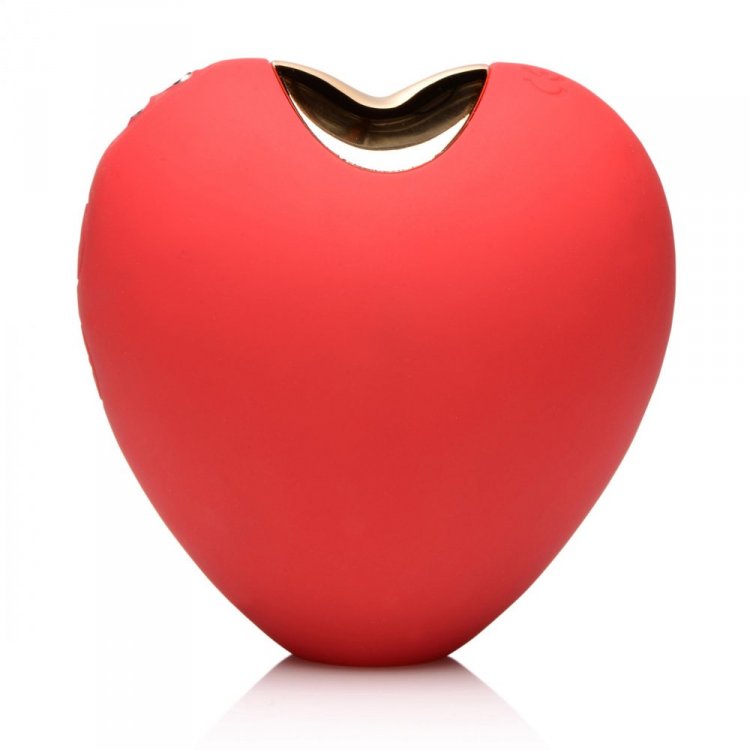 Red heart-shaped clitoral suction toy with a gold opening.