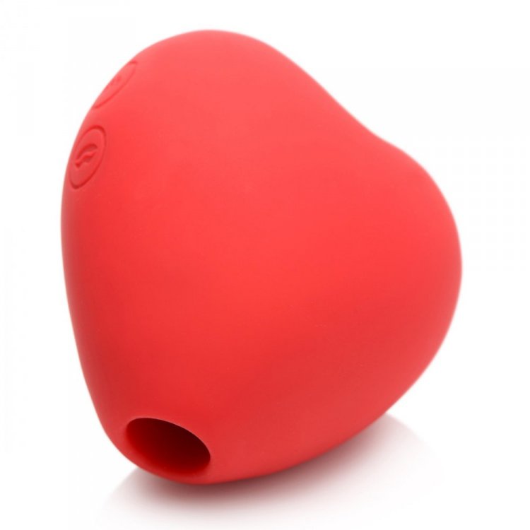 Red heart-shaped silicone clitoral suction toy with a hole at the bottom.