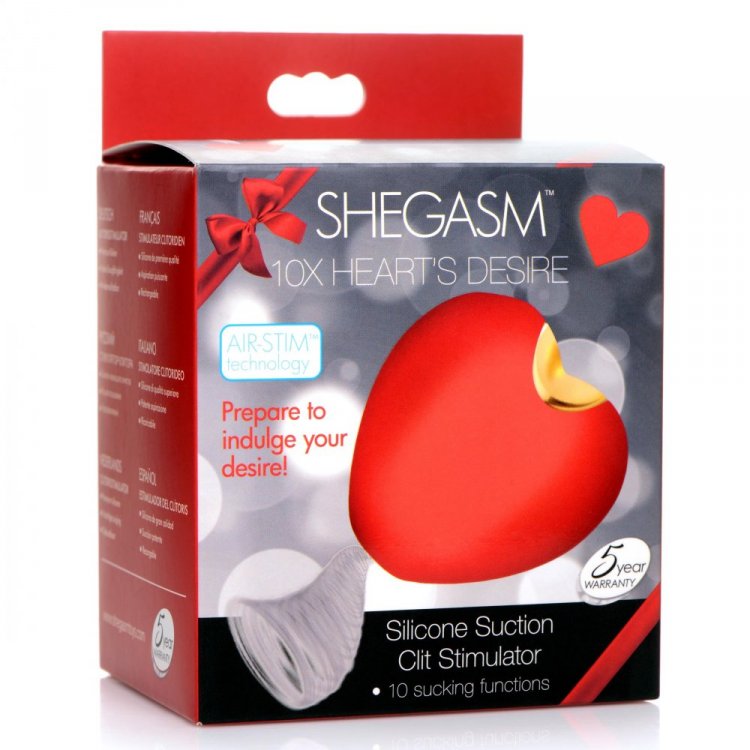 Red heart-shaped silicone clitoral suction toy with gold accent.
