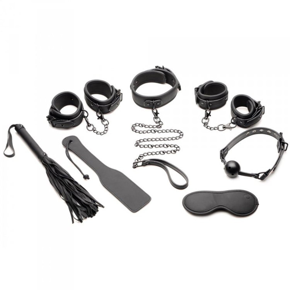 Black vegan leather bondage set with cuffs, collar, leash, ball gag, flogger, paddle, and blindfold.
