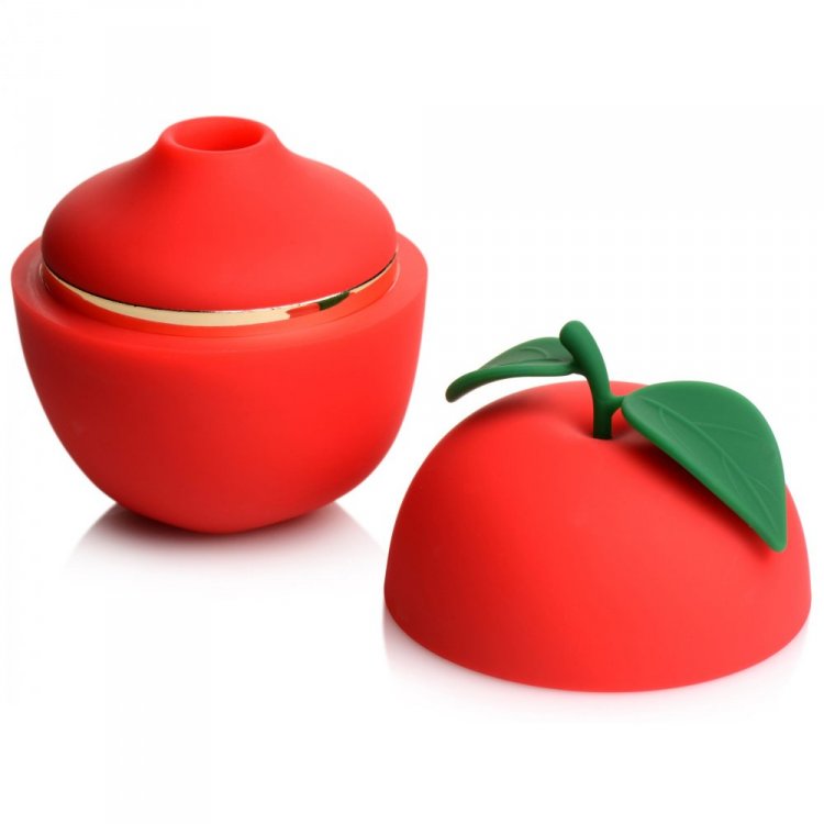 Red apple-shaped clitoral stimulator with a gold rim and green leaf.