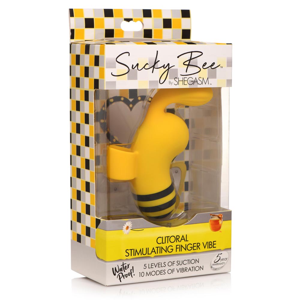 A yellow bee-shaped clitoral stimulator in its packaging.
