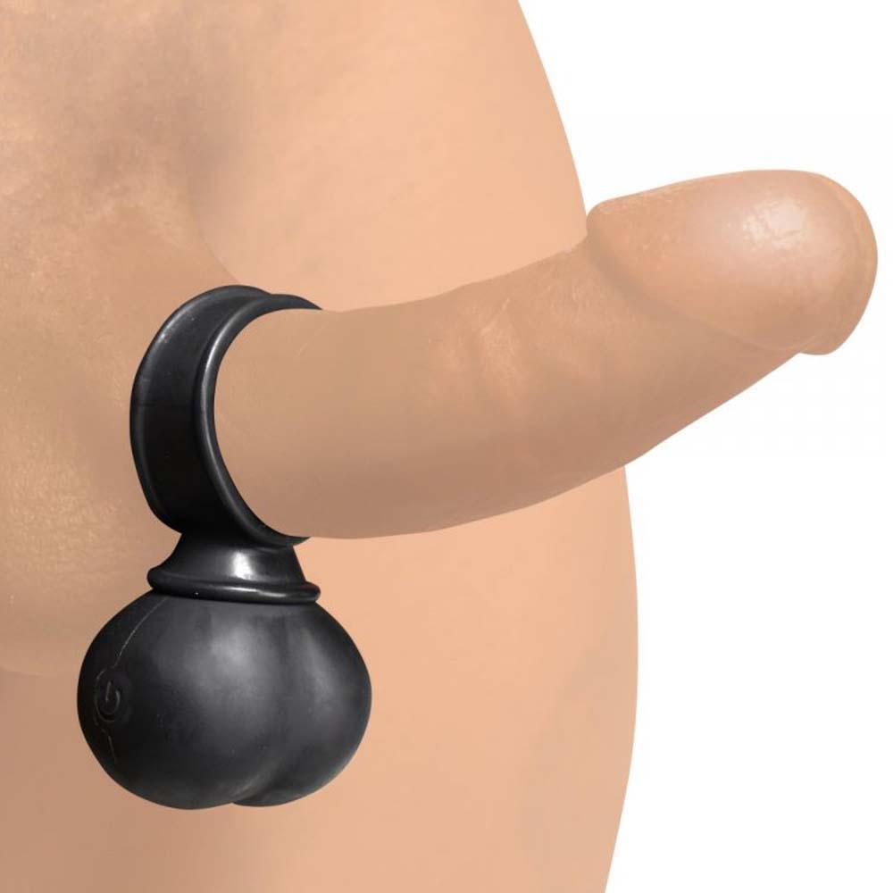 Black silicone cock ring with remote-controlled vibrating balls attached to a realistic penis model.