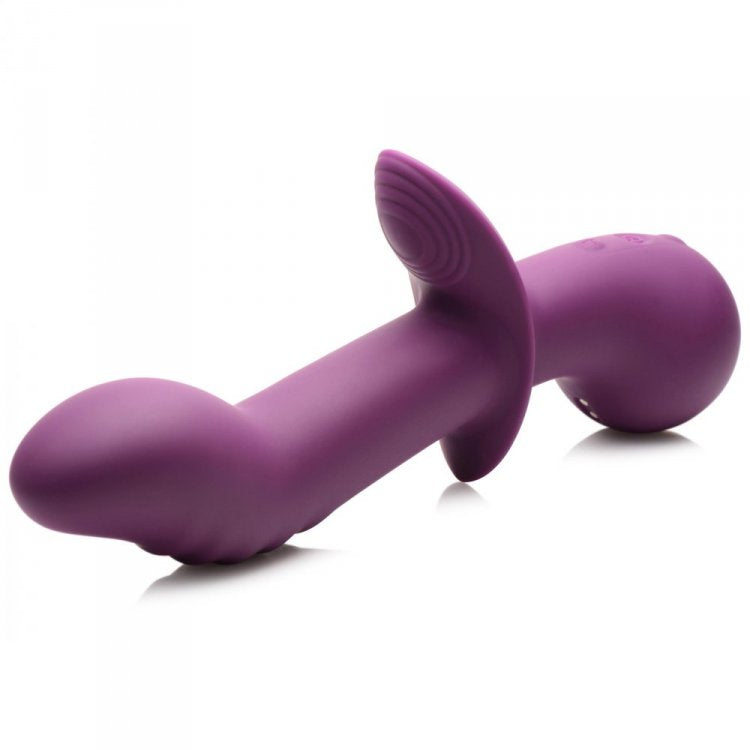 A purple silicone vibrator with a curved shaft and a flared base.