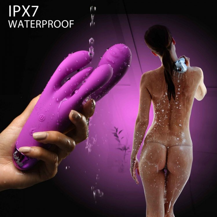 Purple silicone triple rabbit vibrator held in hand, with a nude woman in shower, showing IPX7 waterproof rating.