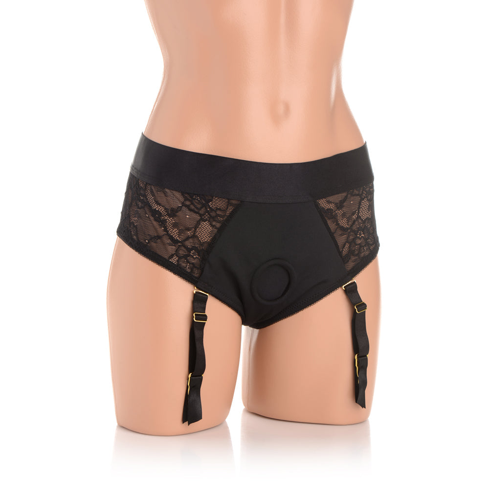 Black lace and nylon crotchless harness panties with adjustable garters.