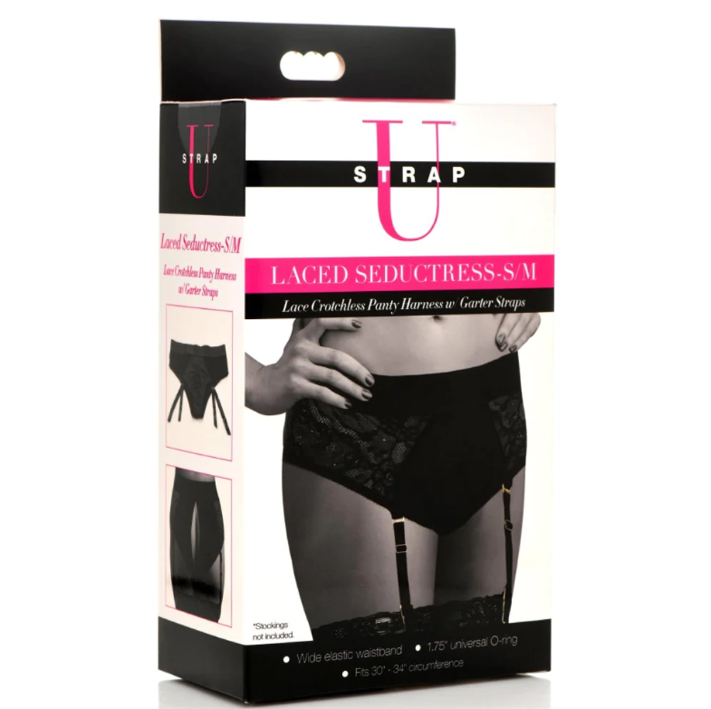 Black lace crotchless panty harness with garter straps.
