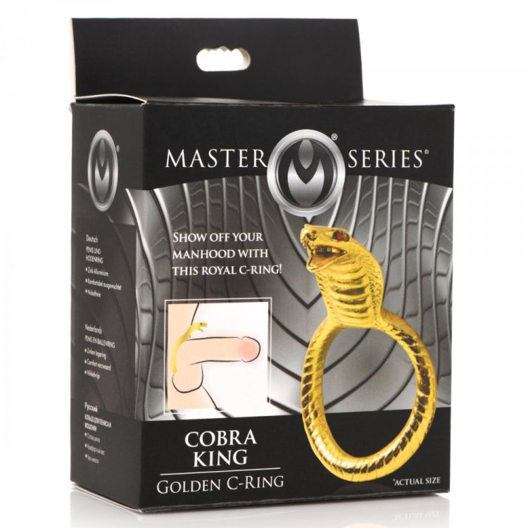Gold cobra-shaped cock ring with red eyes on a black box.