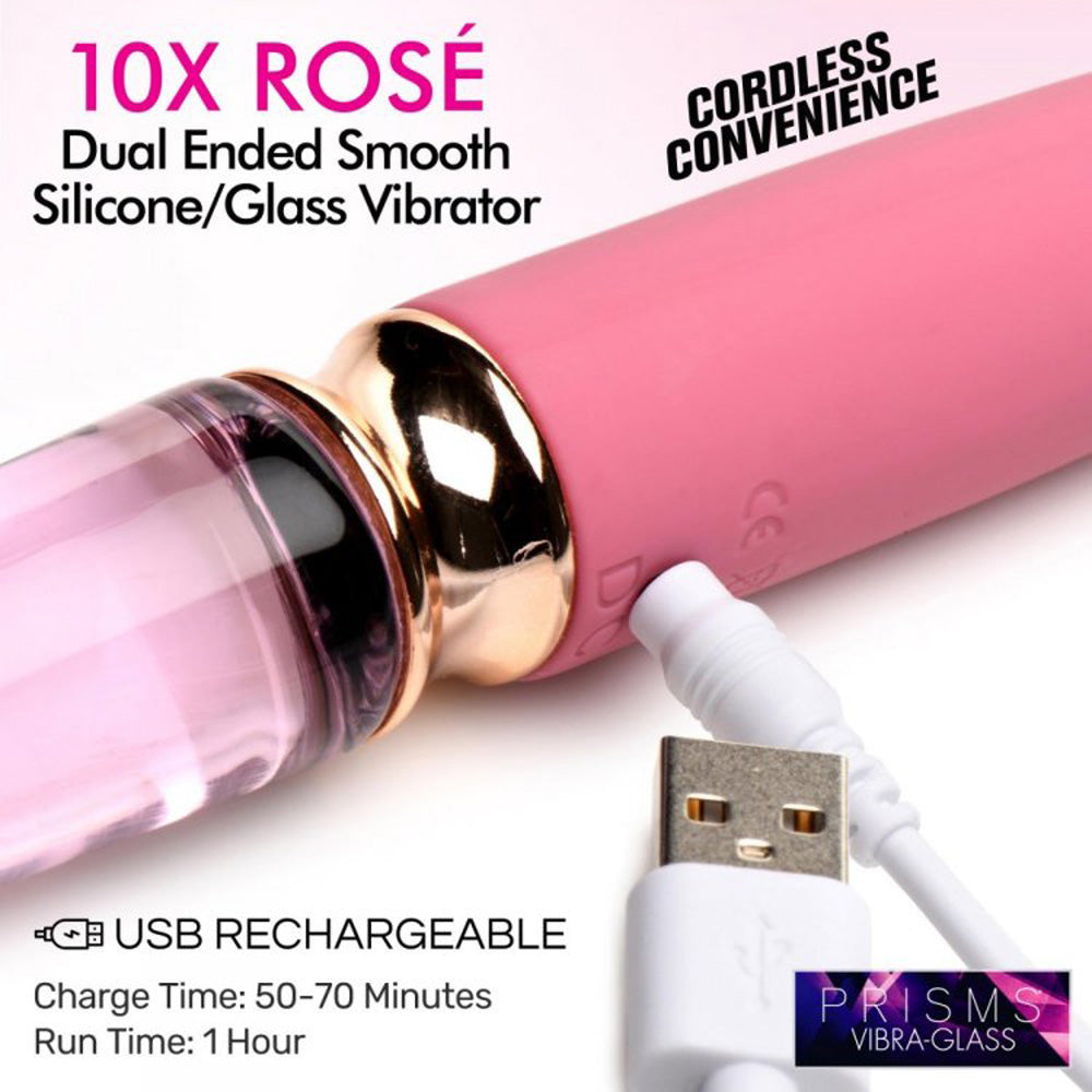 Pink dual-ended glass and silicone vibrator with USB charging cable.