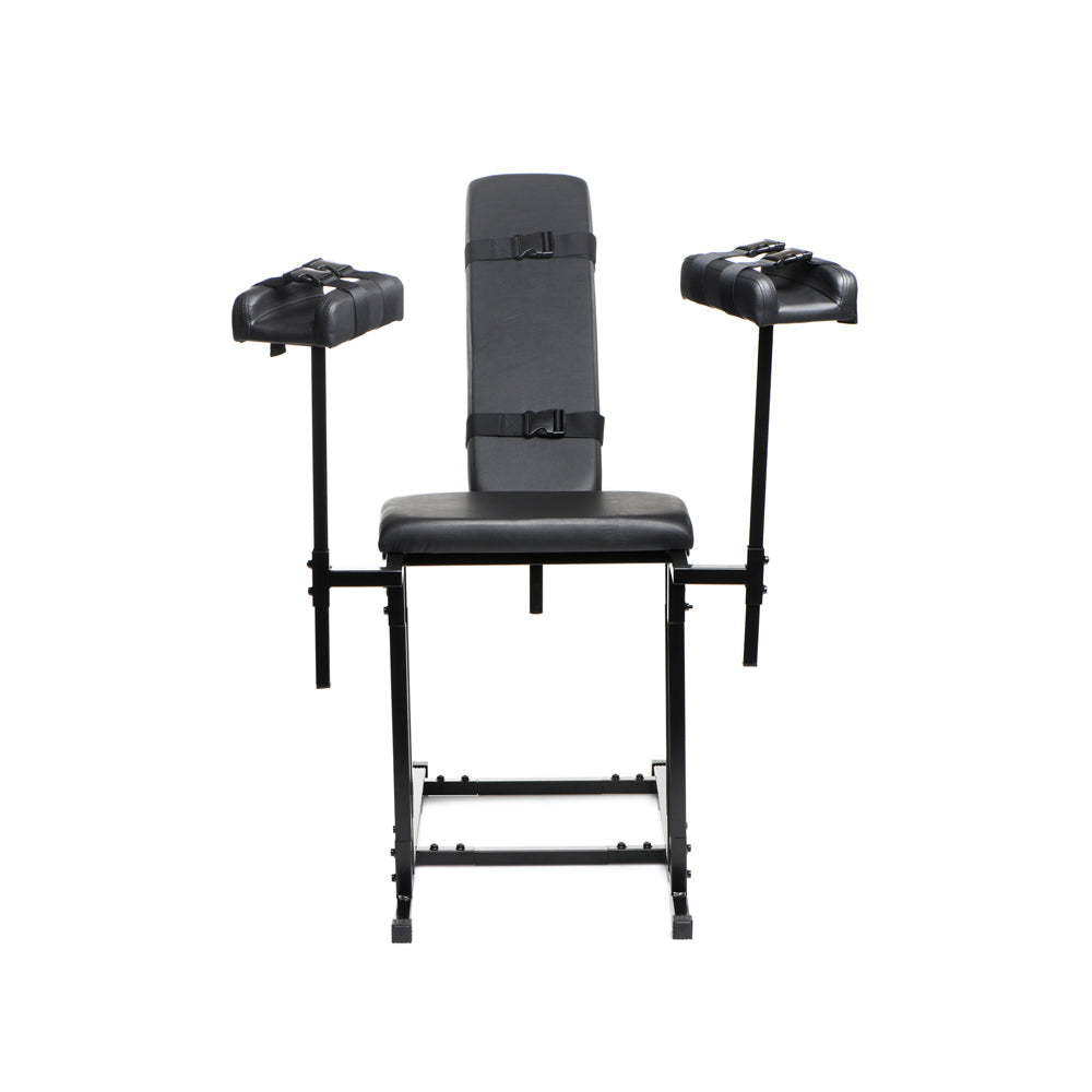 Black adjustable bondage chair with padded seat, backrest, and arm restraints.