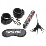 A four-piece bondage kit including wrist cuffs, a bullet vibrator, a feather tickler, and a blindfold.