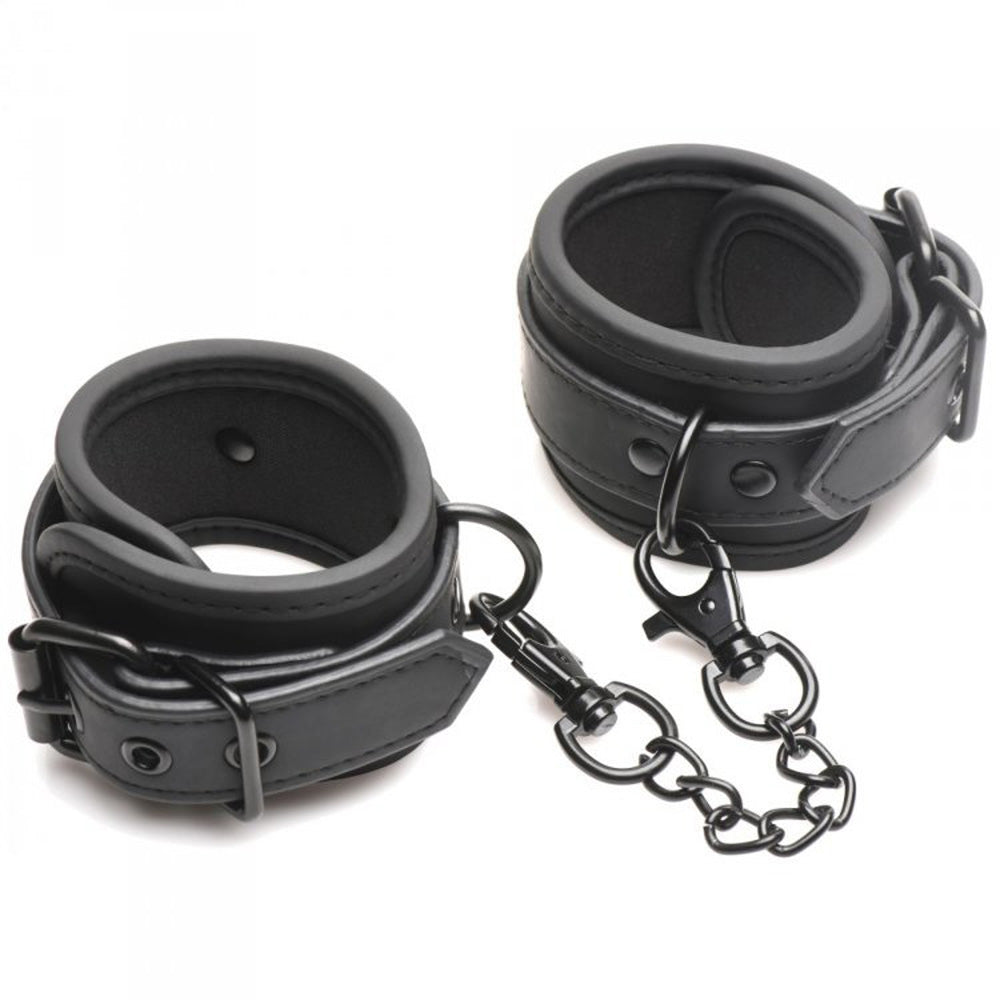 Black leather wrist cuffs connected by a metal chain.