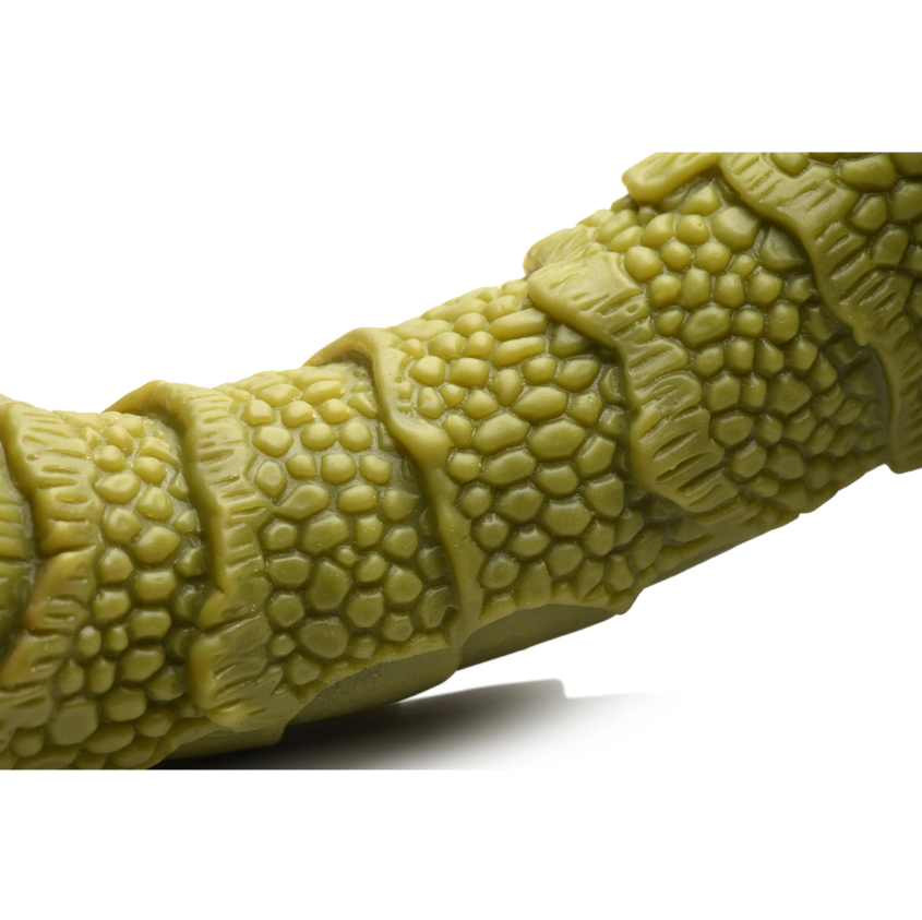 Green scaly silicone fantasy dildo with textured shaft and suction cup base.