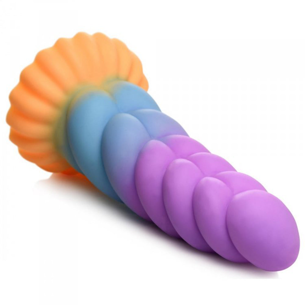 A rainbow-colored silicone dildo with a fluted base and segmented shaft.