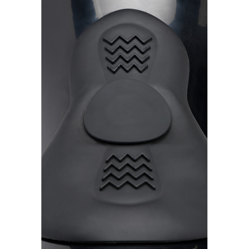 Black saddle with textured wave patterns and a circular indentation.