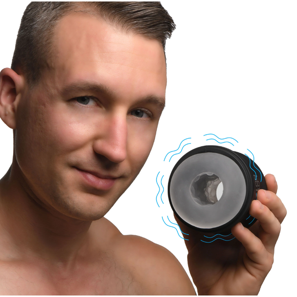 Man holding a black and clear vibrating stroker with blue wavy lines.