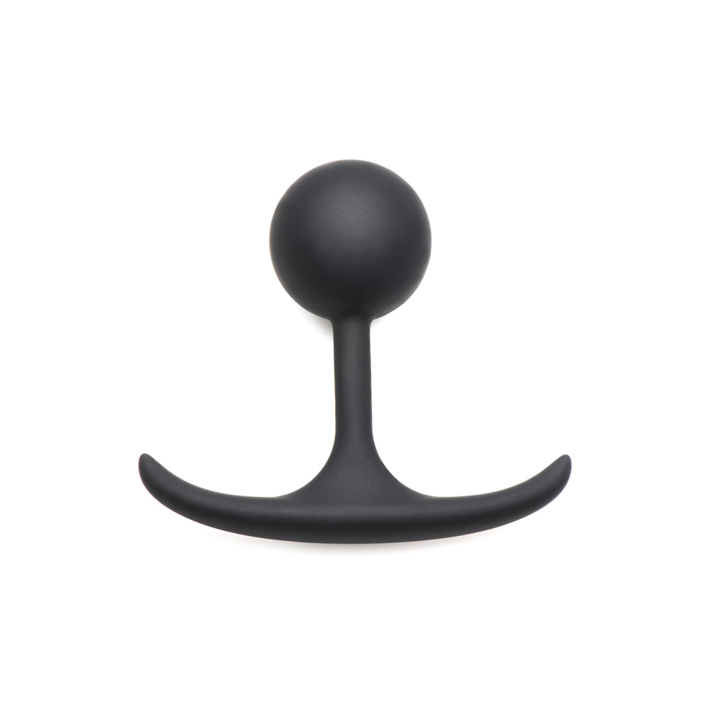 Black weighted silicone anal plug with a curved base.