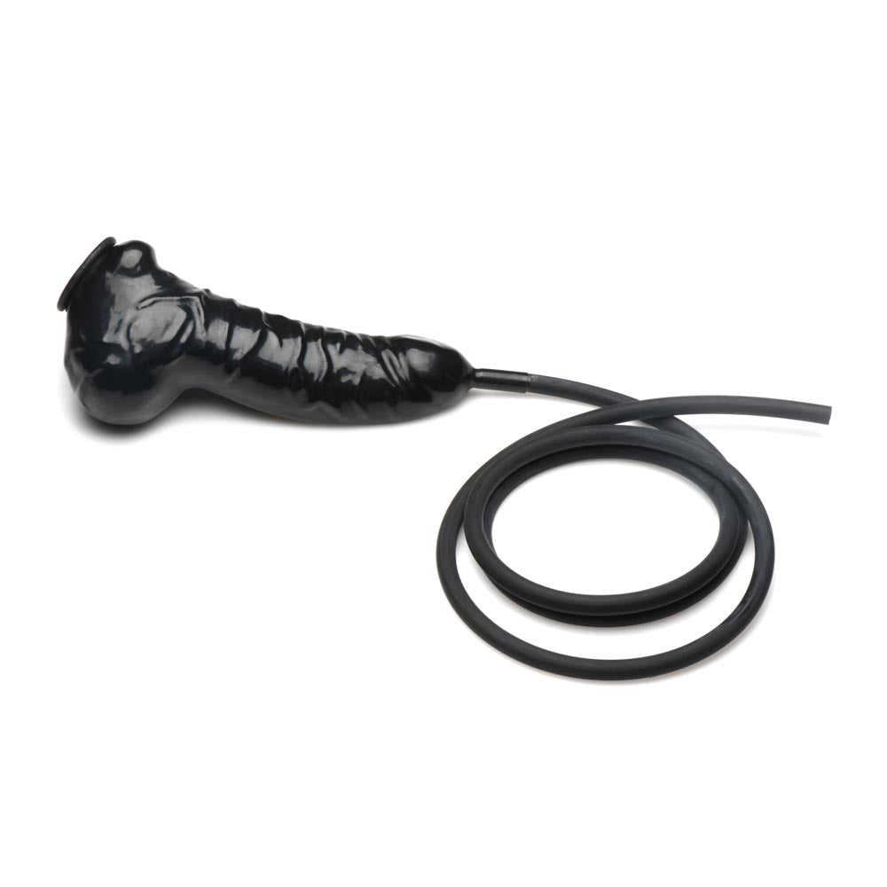Black latex penis sheath with a coiled silicone hose.