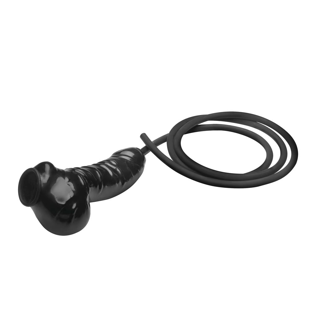 Black latex penis sheath with a coiled silicone hose.