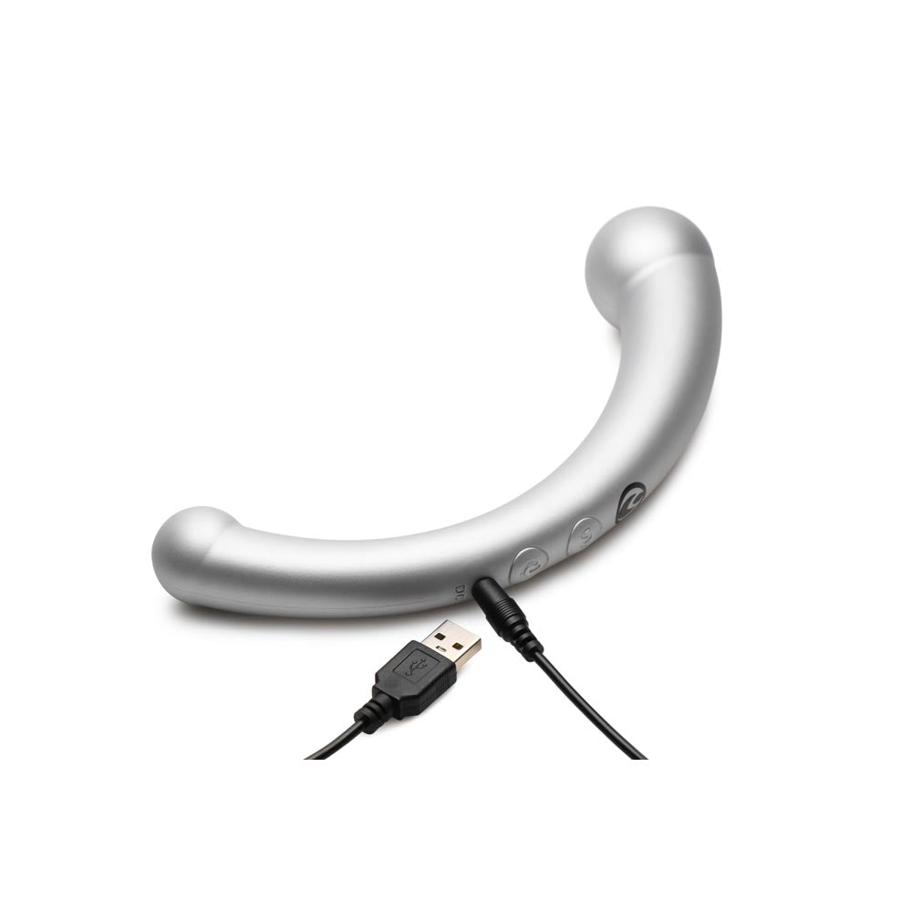 Silver crescent-shaped vibrator with USB charging cable.