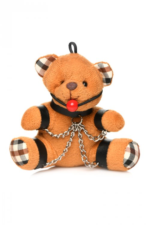 Burnt orange teddy bear keychain with bondage restraints and ball gag.
