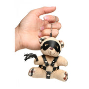 Teddy bear keychain with faux leather harness, mask, and mini flogger.