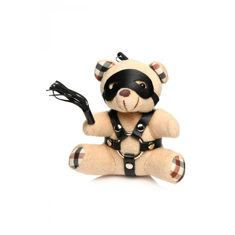 Teddy bear keychain with black faux leather harness, mask, and flogger.