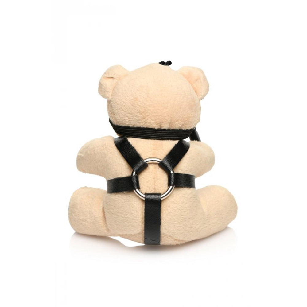 Teddy bear keychain with a black faux leather harness and metal ring.