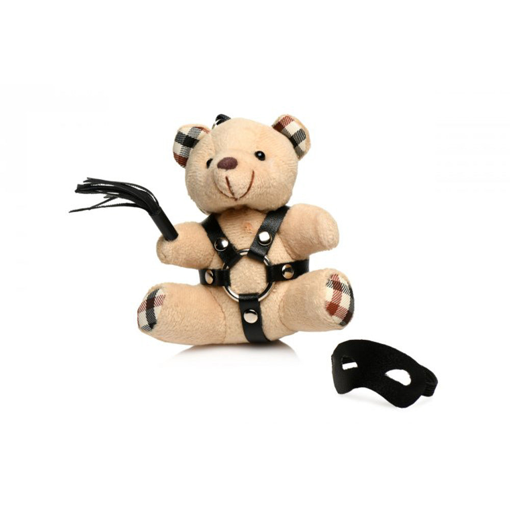 Teddy bear keychain with faux leather harness, flogger, and mask.