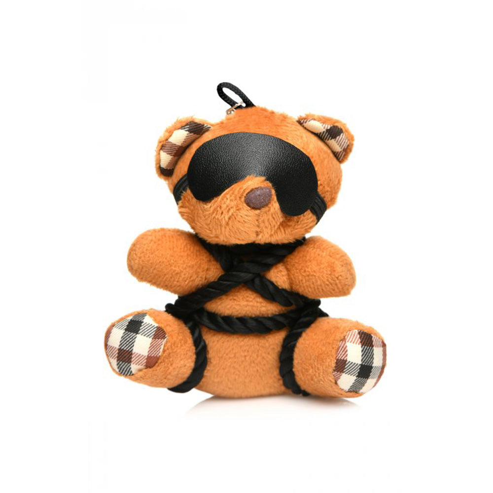 Burnt orange teddy bear keychain with black blindfold and rope bondage details.