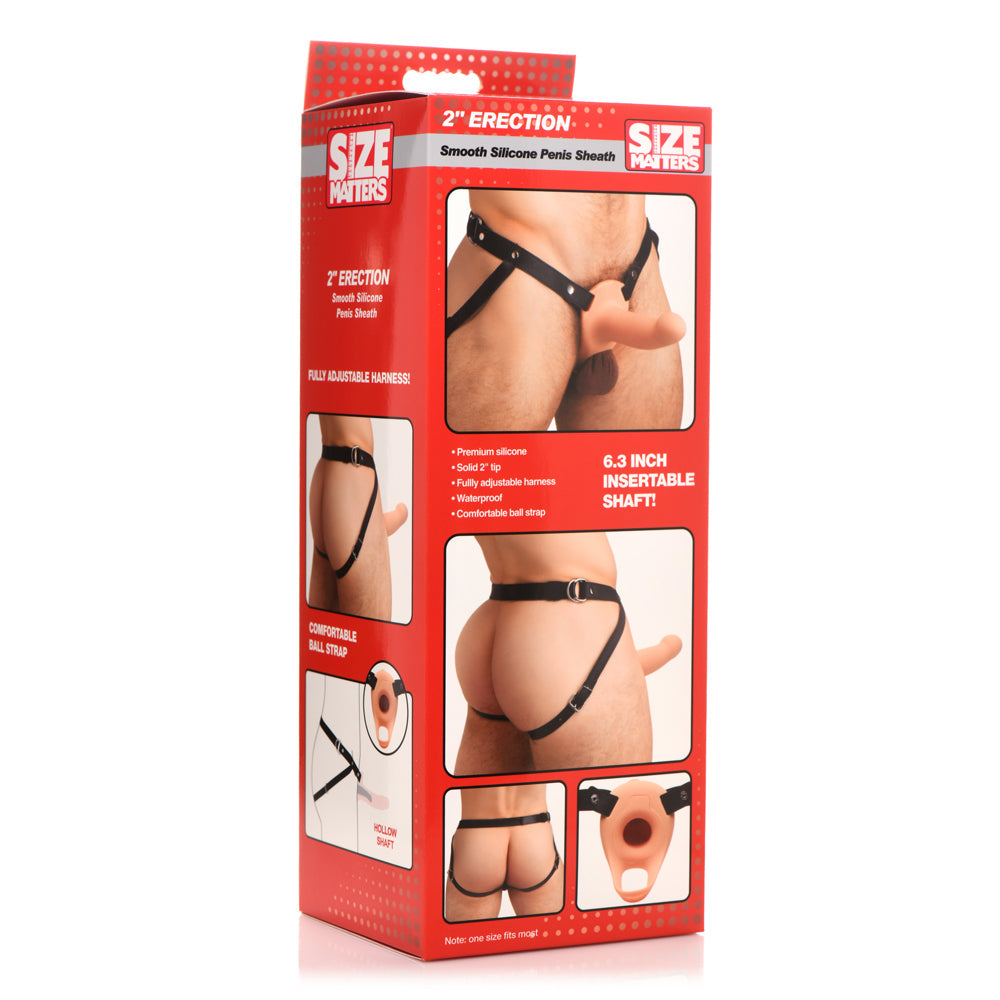 Silicone penis sheath with adjustable harness and insertable shaft.