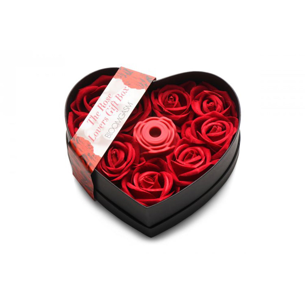 Heart-shaped gift box with red faux roses and a red silicone rose toy.