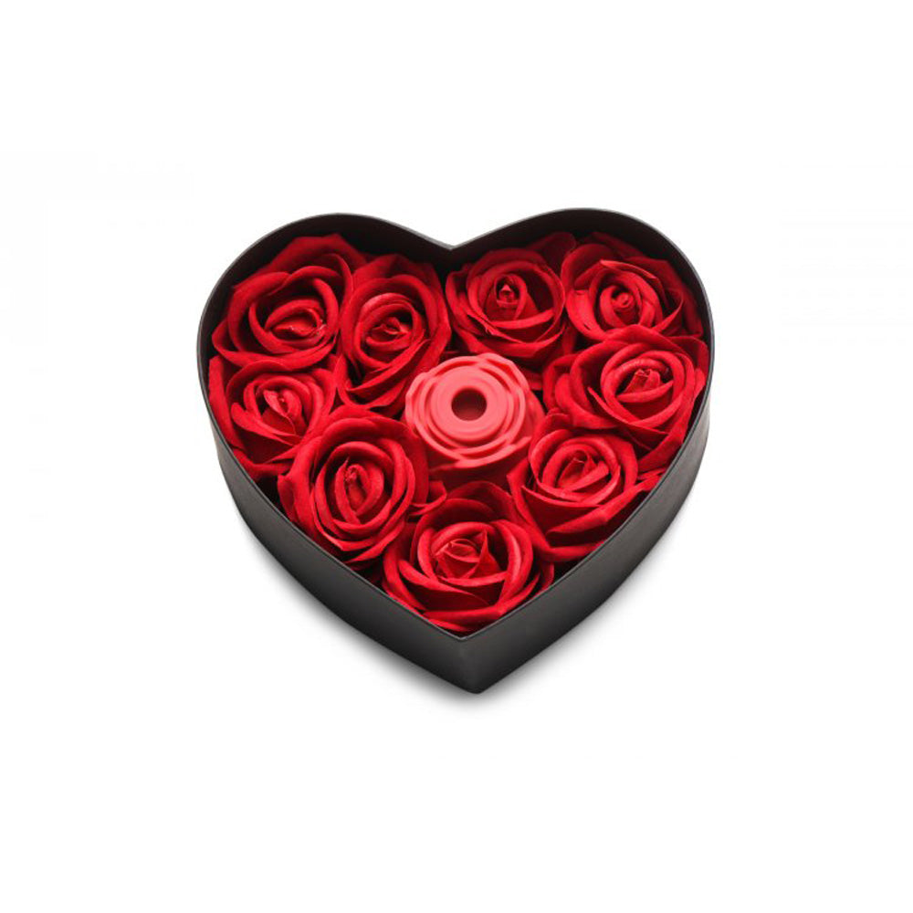 Heart-shaped gift box with red faux roses and a pink rose-shaped silicone toy.