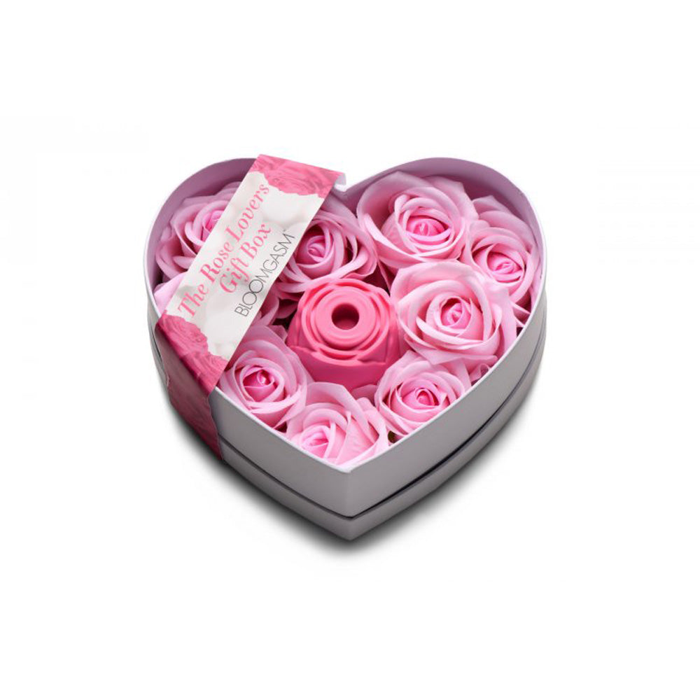 Heart-shaped gift box with pink faux roses and a pink silicone rose toy.