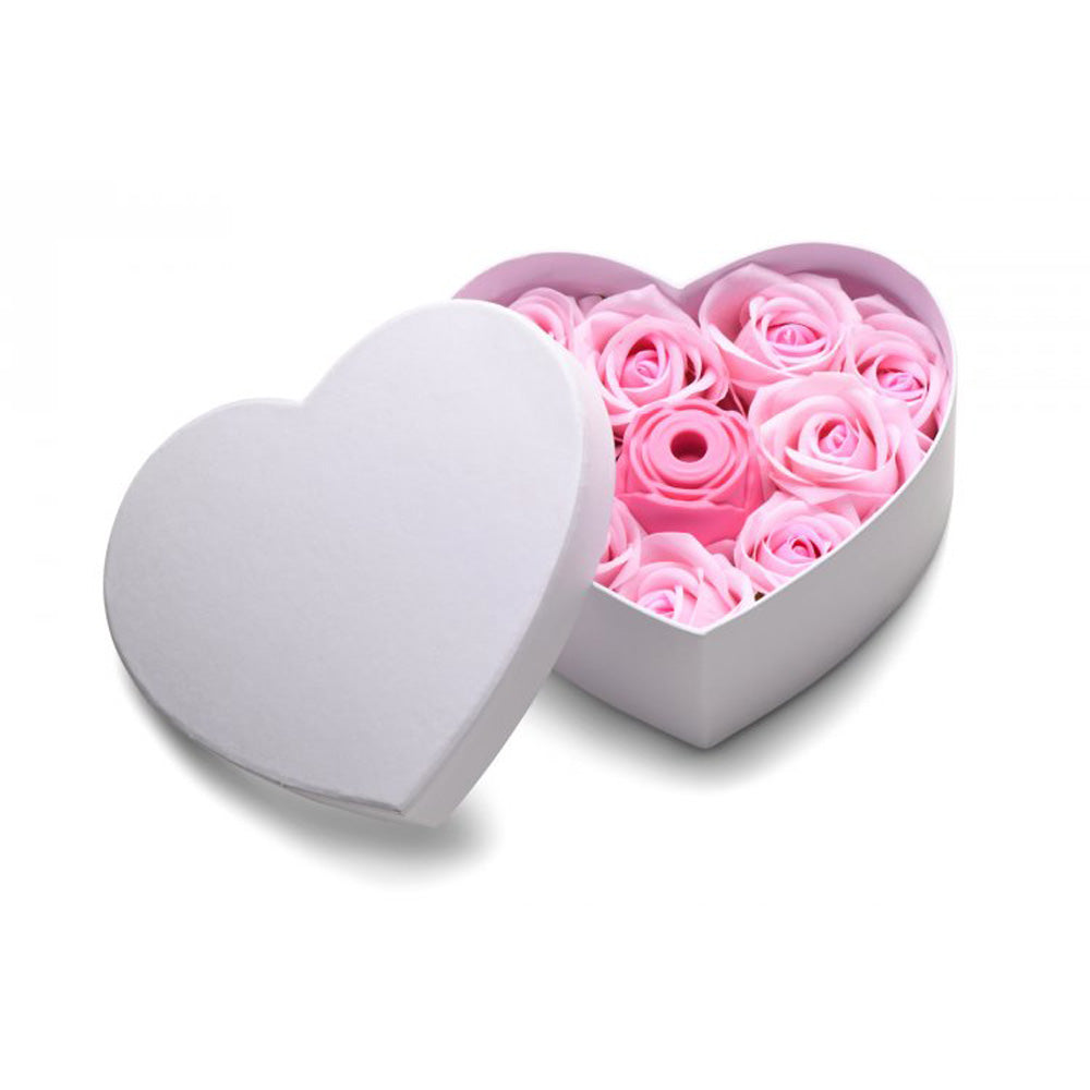 Heart-shaped gift box with pink faux roses and a white lid.