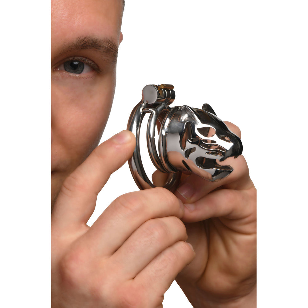 A silver chastity cage with a cougar head design.