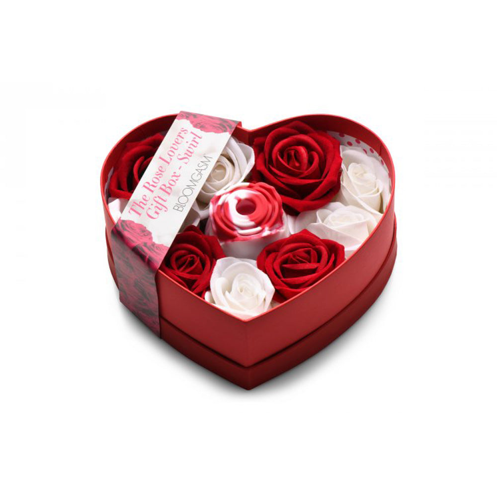 Heart-shaped gift box with red and white faux roses and a swirl rose toy.