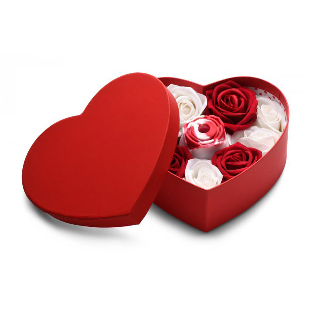 Red heart-shaped gift box with red and white faux roses.