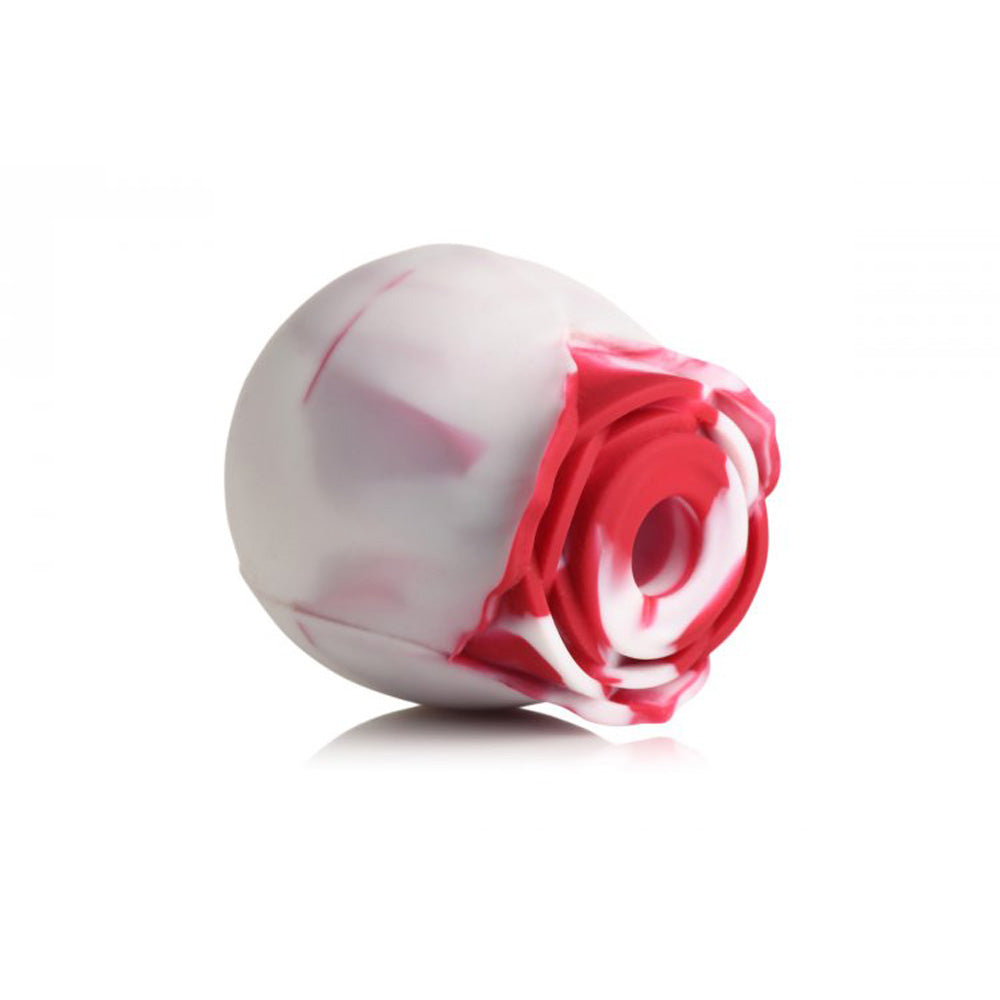 Silicone rose toy with red and white swirls.